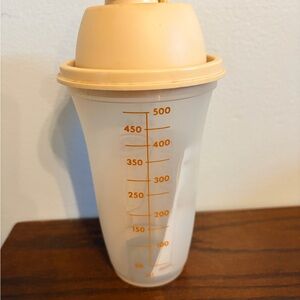 Tupperware Quick Shake container with a harvest gold lid